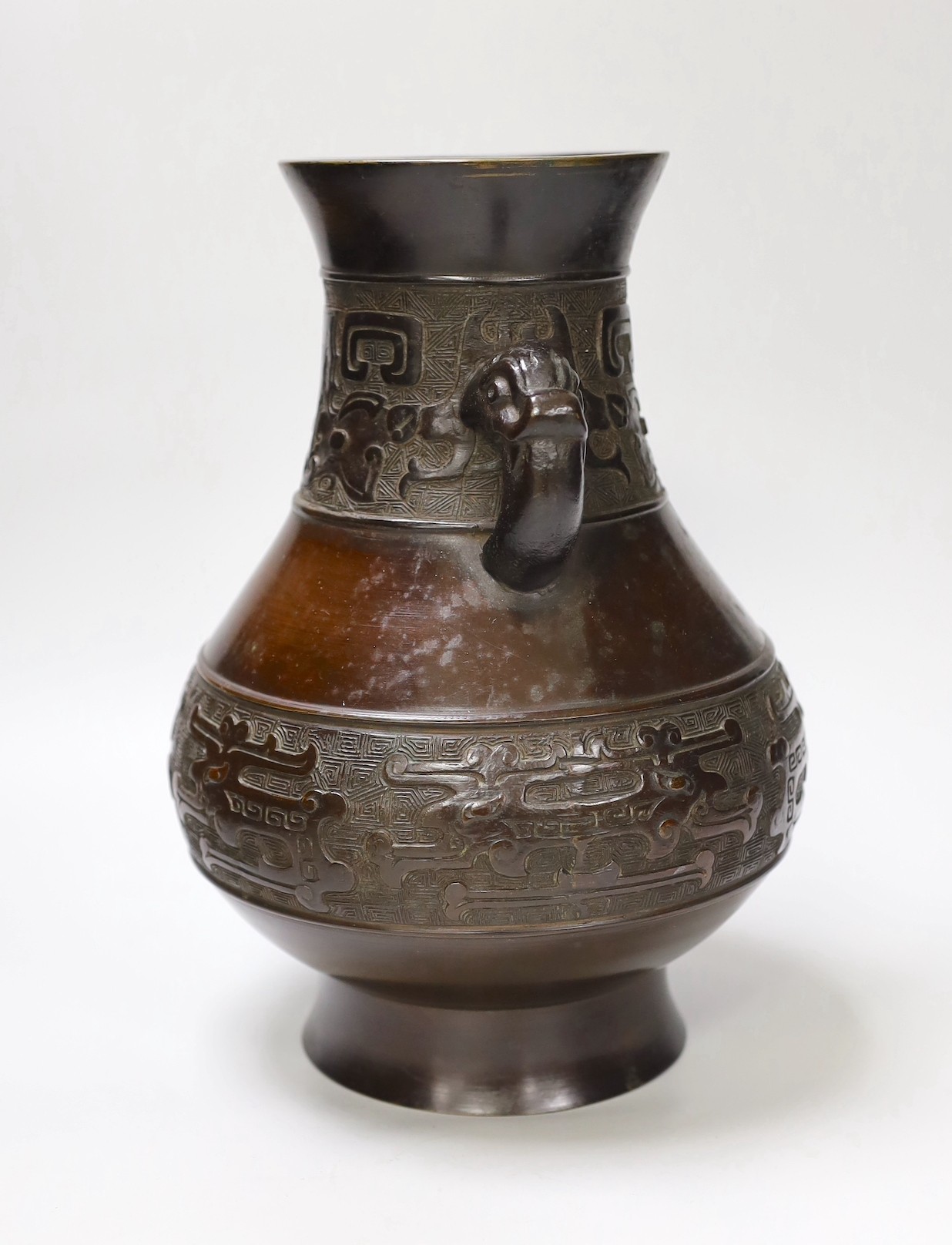 A Chinese archaistic bronze double handled 'hu' vase, 19th century, 27.5cm high